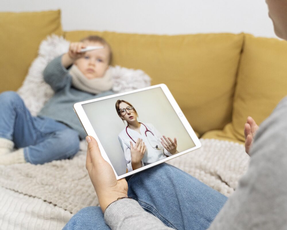 mom-taking-care-her-child-teleconsulting-with-doctor