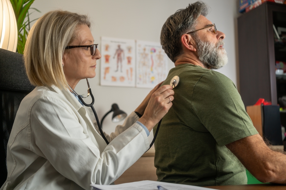 Man being examined for pain